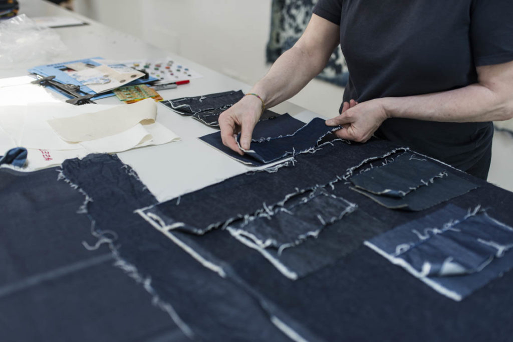 Lucia checks the CALIK DENIM and ROYO textiles shrinkage.